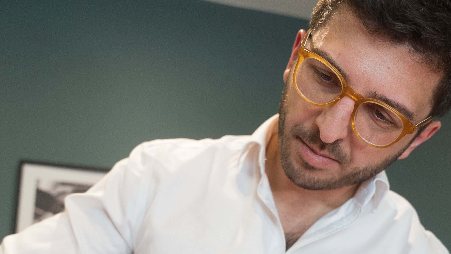 Male skincare specialist consulting patient at Cannelle Skin Clinic.