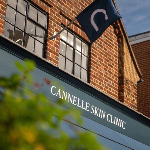 Exterior view of Cannelle Skin Clinic with signage on brick building in the UK.