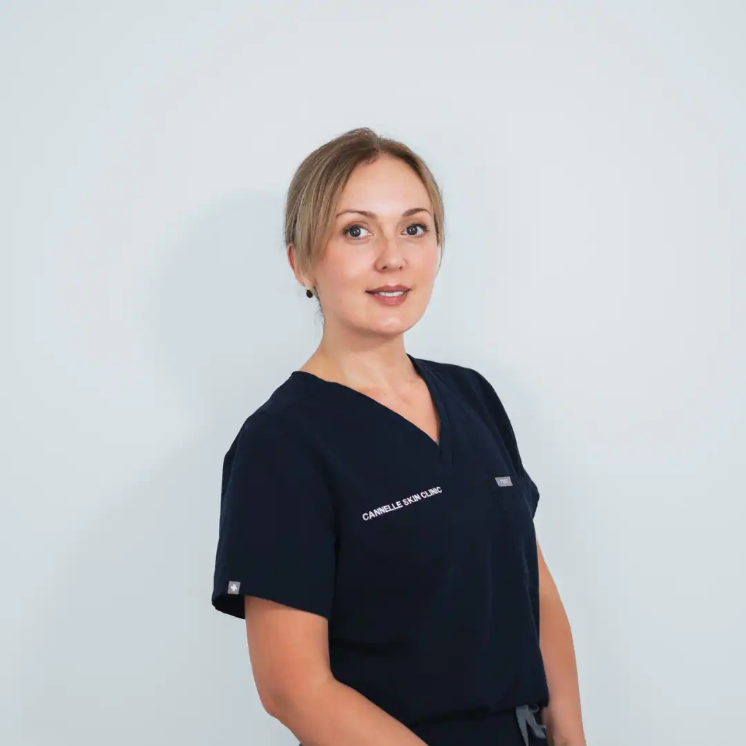 Professional skin specialist in navy uniform at Cannelle Skin Clinic.