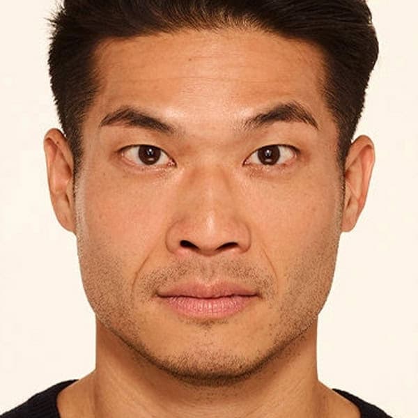 Close-up of a man with clear, smooth skin after facial treatment at Cannelle Skin Clinic.
