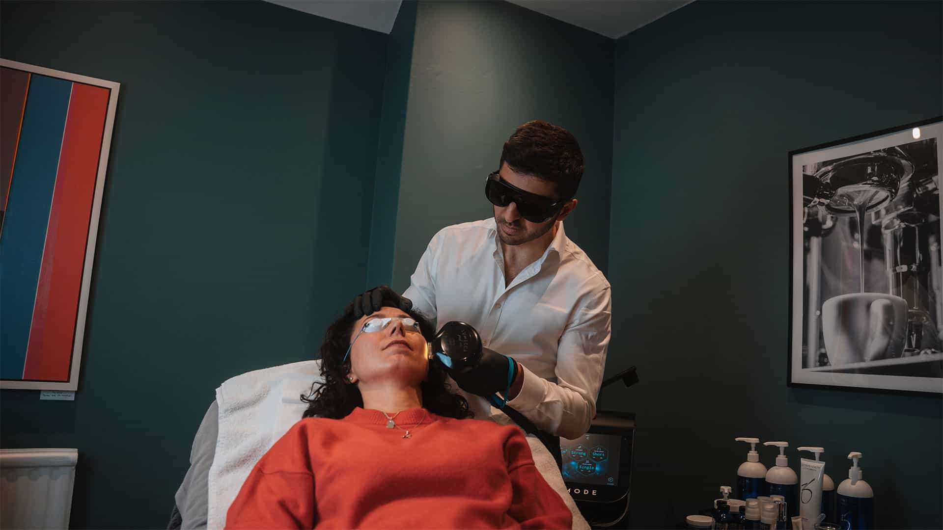 A woman receiving a facial treatment at Cannelle Skin Clinic, with a professional practitioner using.