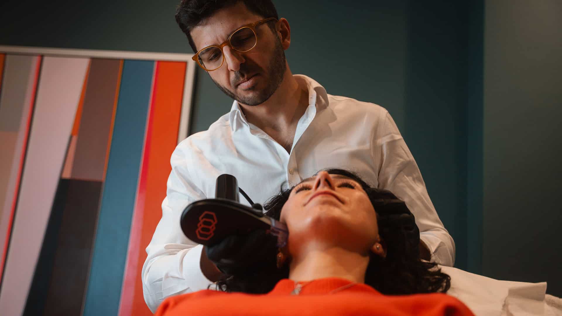 Woman receiving skin rejuvenation treatment at Cannelle Skin Clinic, professional skincare expert.