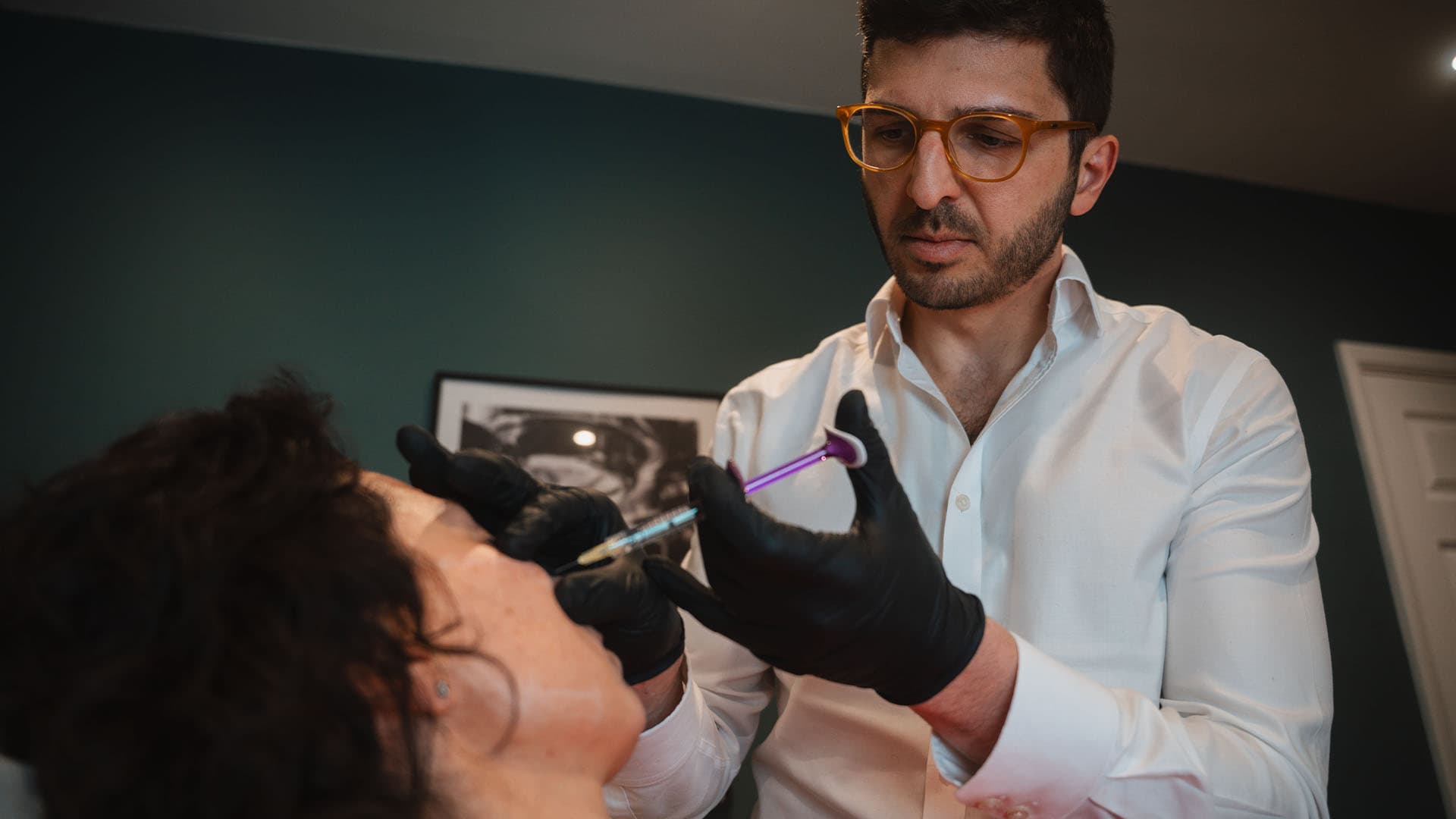 Medical professional administering dermal filler injection to a patient at Cannelle Skin Clinic.