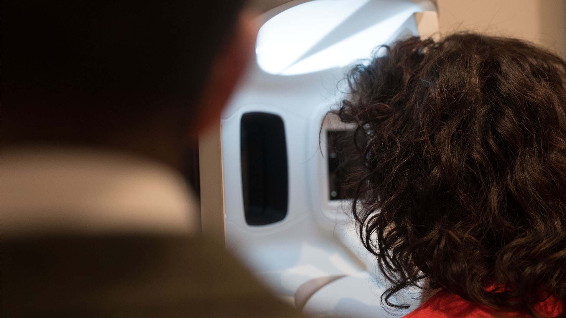 Patient undergoing skin analysis with a state-of-the-art imaging device at Cannelle Skin Clinic.