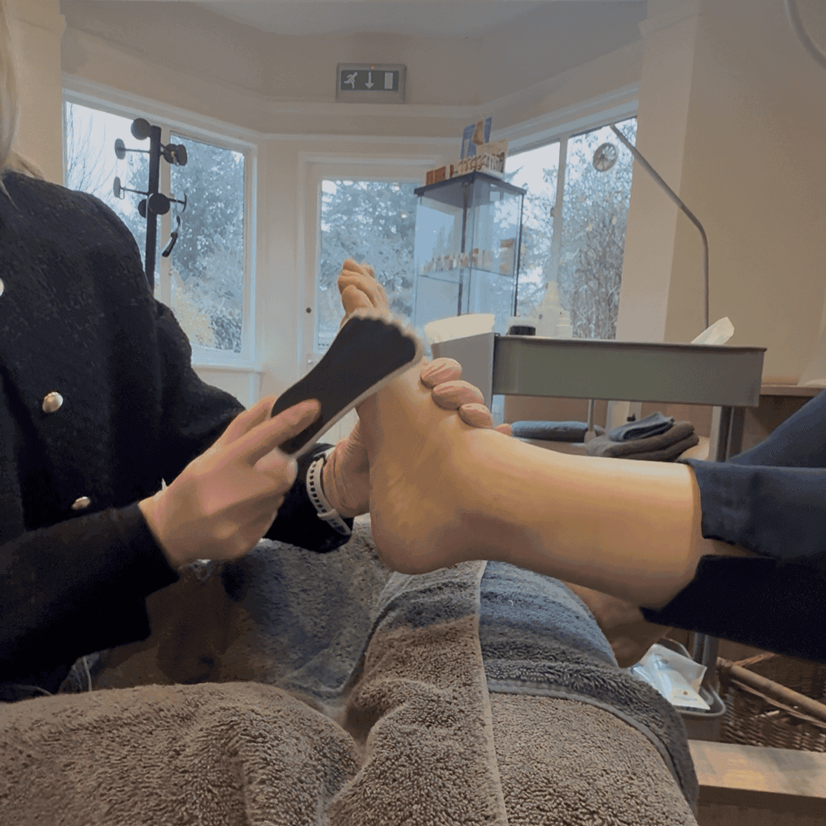 Foot therapy session at Cannelle Skin Clinic with a focus on skincare and relaxation.