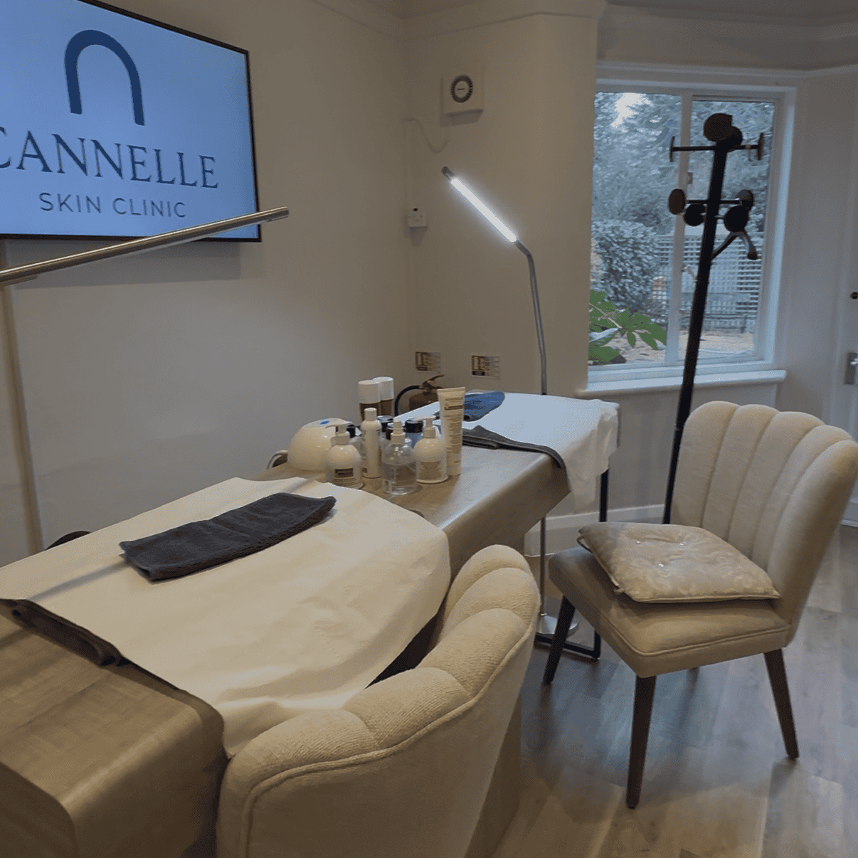 Modern skincare treatment room at Cannelle Skin Clinic with relaxing chairs and professional equipme.