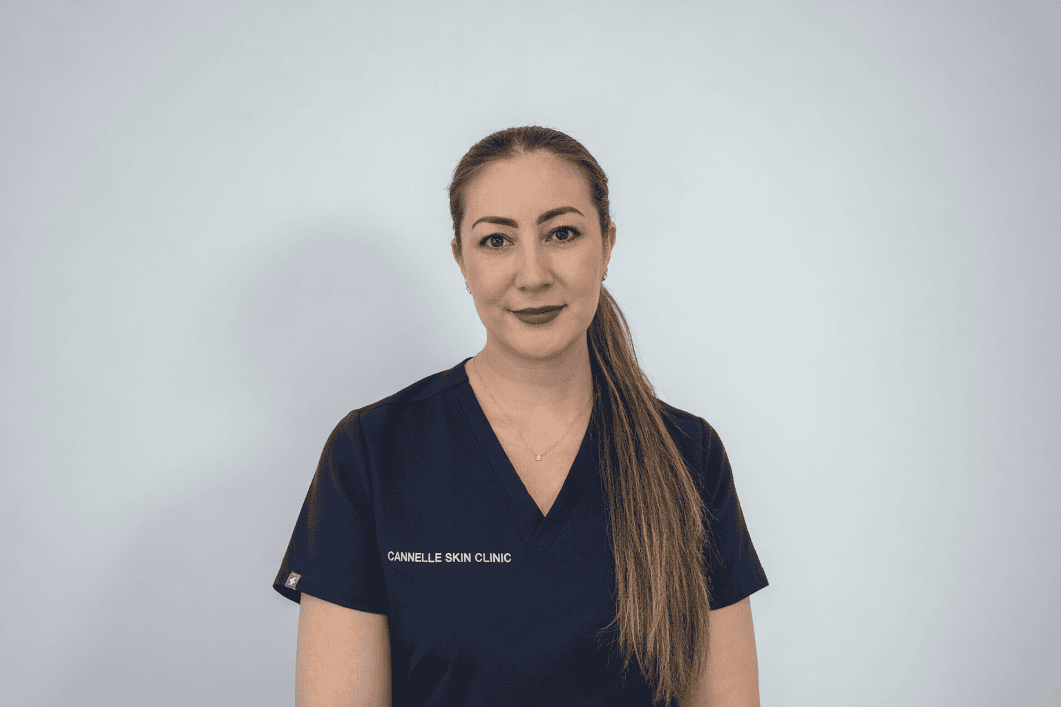 Professional staff member at Cannelle Skin Clinic in uniform.