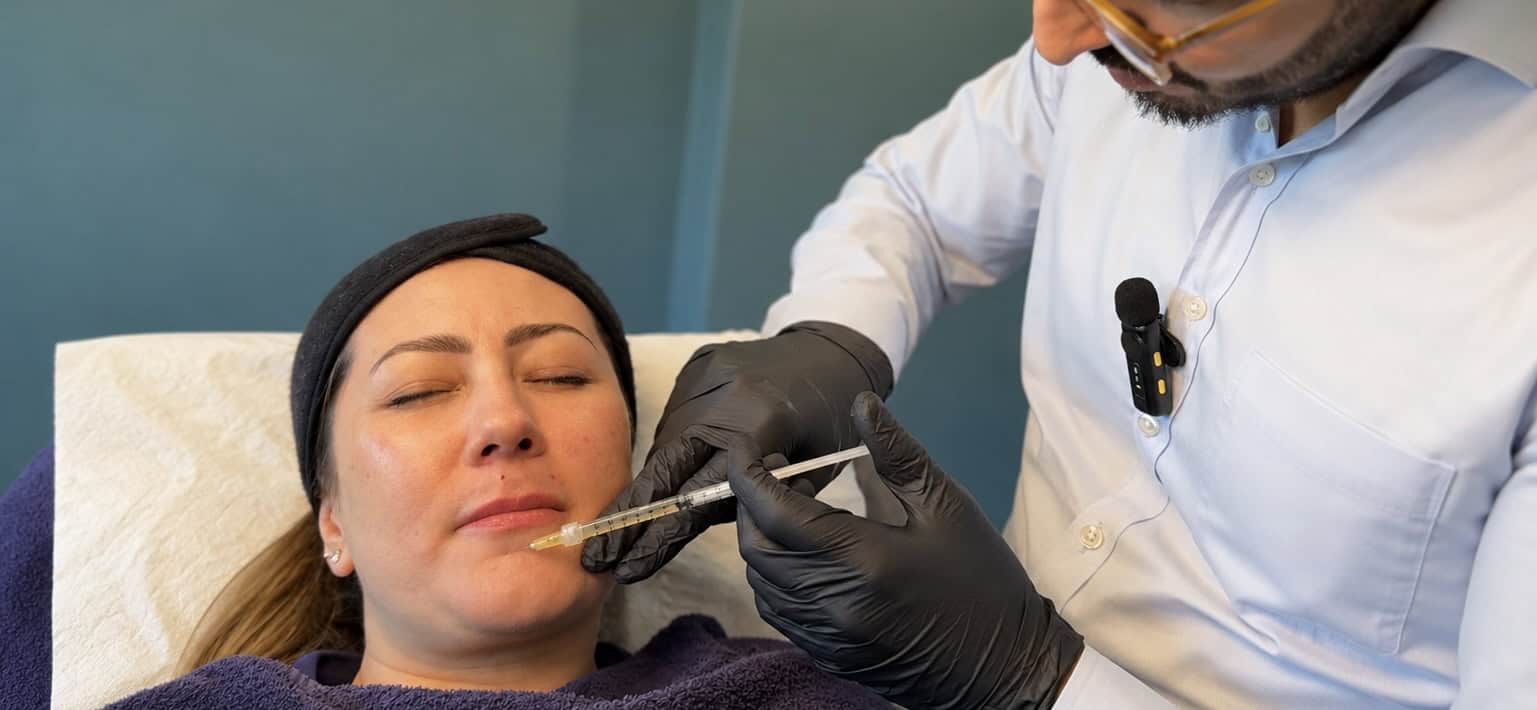 Woman receiving a facial treatment at Cannelle Skin Clinic for skin rejuvenation.