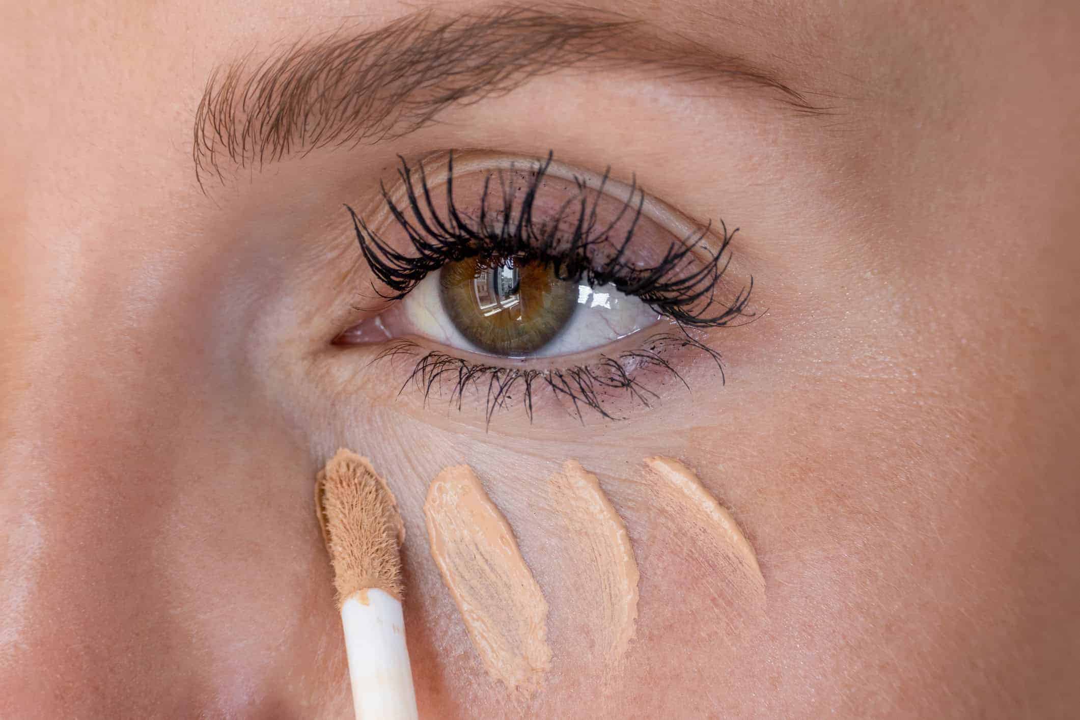 Concealer being applied to the under-eye area
