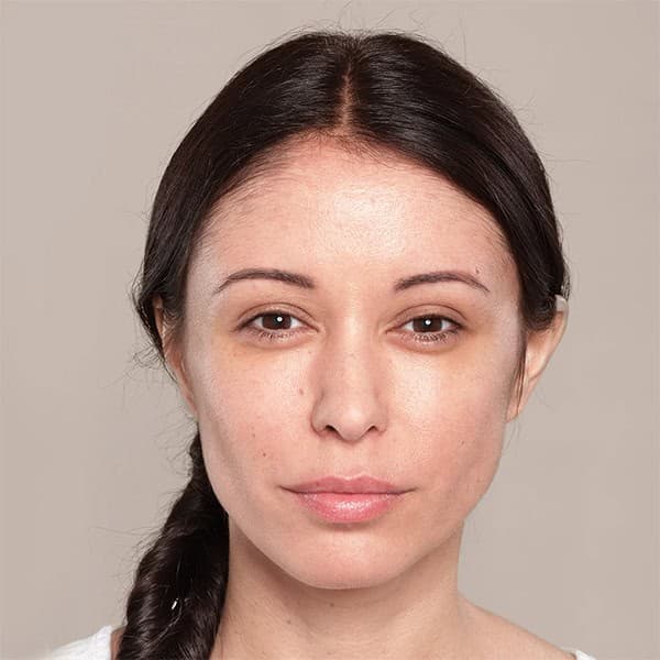 Woman with clear, smooth skin after facial treatment at Cannelle Skin Clinic.