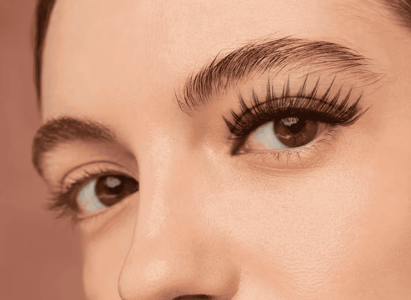 Close-up of a woman's eye with well-groomed eyebrows and long eyelashes, promoting skin and eyelash.
