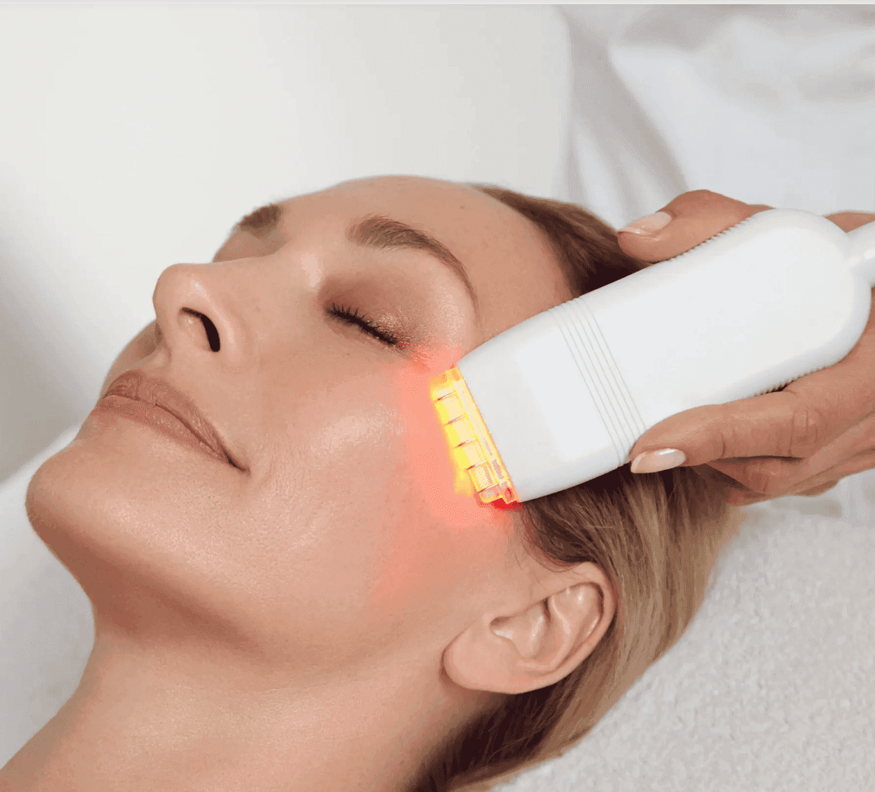 Woman receiving skin rejuvenation laser treatment at Cannelle Skin Clinic.