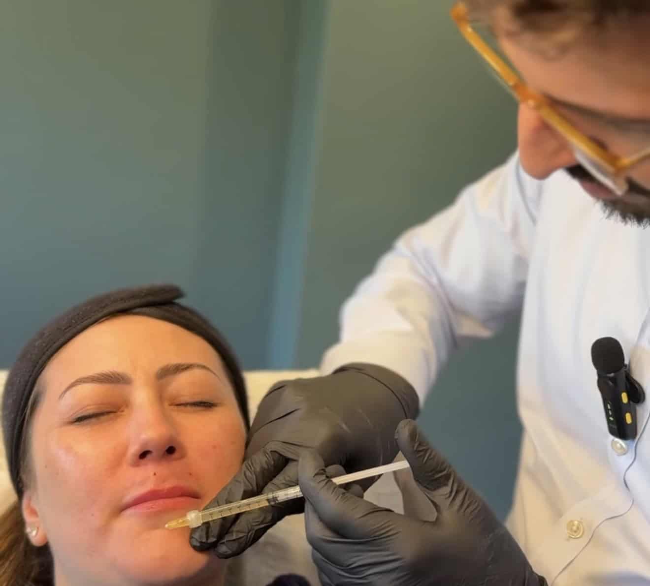 Woman receiving skin treatment with a professional at Cannelle Skin Clinic, London.
