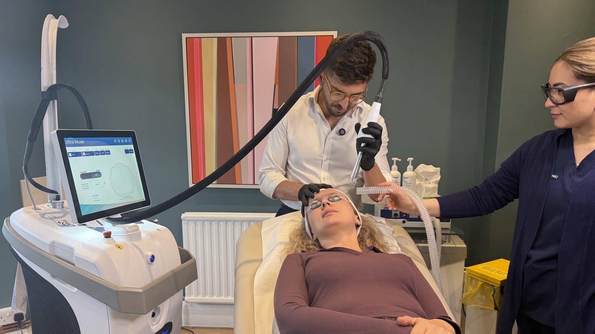 Dr Mattia Parducci treating a patient with the UltraClear laser at Cannelle Skin Clinic in Oxford