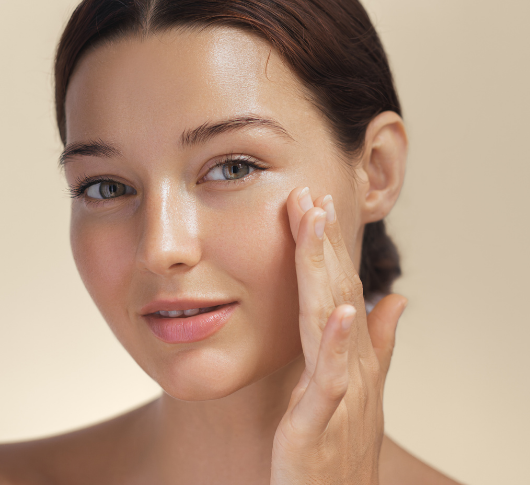 Beautiful woman with radiant skin facing camera