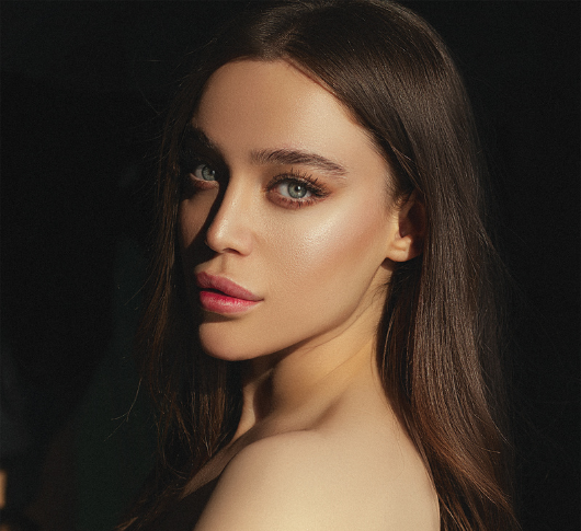 Beautiful woman with radiant skin looking at the camera