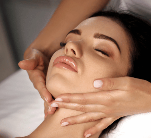 brunette being prepared for carbon facial