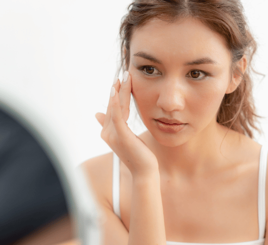 Checking skin in the mirror
