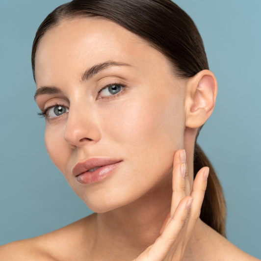 woman checking out her skin after HIFU treatment