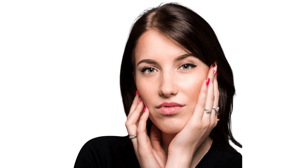 woman holding her face with her hands and smiling