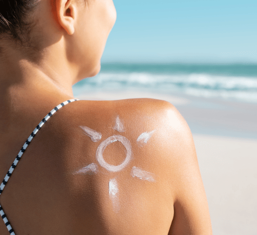Sun screen on the shoulder of a woman