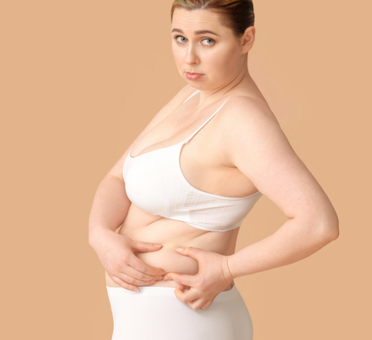 Woman looking unhappy about her body shape
