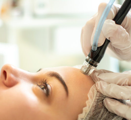 Woman receives non-invasive HydraFacial therapy