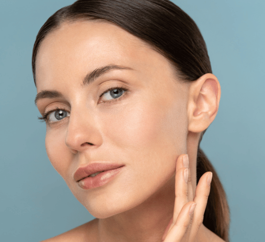 woman touching her soft skin after ZO treatment