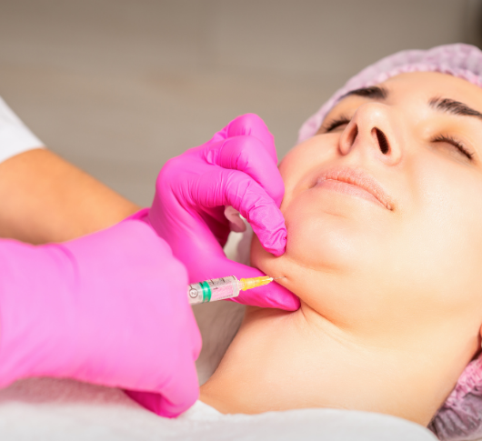 Woman undergoing non-surgical chin filler treatment