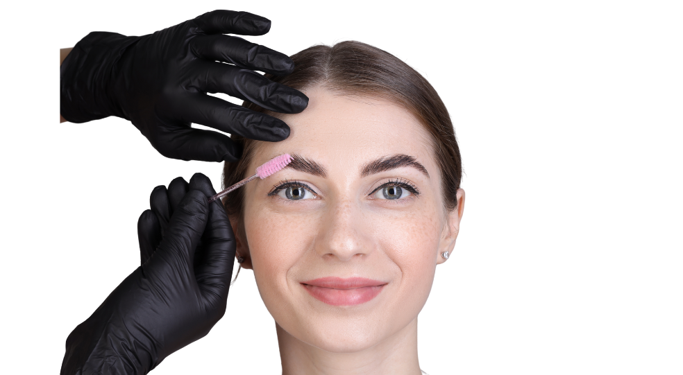 A smiling woman receiving an Eyebrows treatment